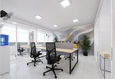 Modern open-plan office with white walls, black ergonomic chairs, and indoor plants.