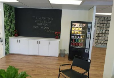 Reception area featuring a chalkboard wall and snack vending machine.