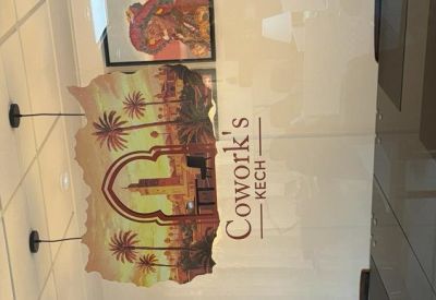 Branded glass partition with a desert-themed illustration at the entrance.