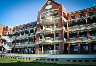 Exterior view of the red brick facade at Brookside Office Park, 11 Imam Haron Road, Claremont, Cape Town.