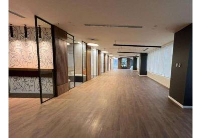 Bright reception area with patterned feature walls and warm wood-style flooring.