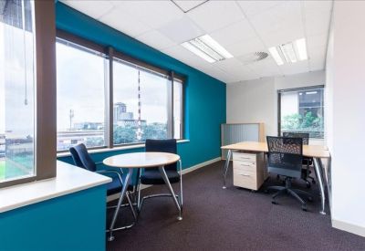 Two-person private office featuring light wood desks and a vibrant teal accent wall.