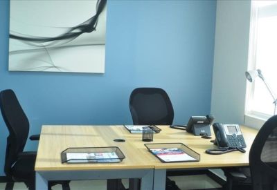 Professional two-person office with blue accent wall.