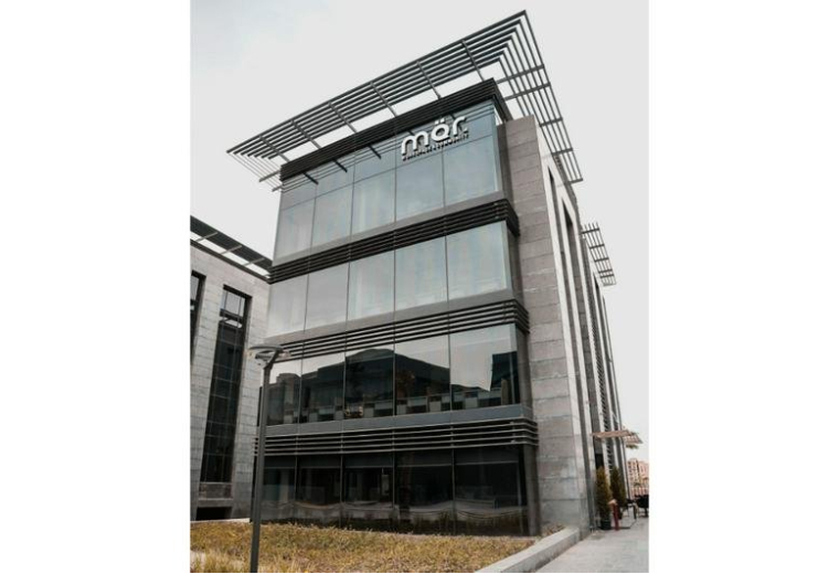 Exterior view of the modern glass-fronted building at Cairo Business Park, New Cairo.