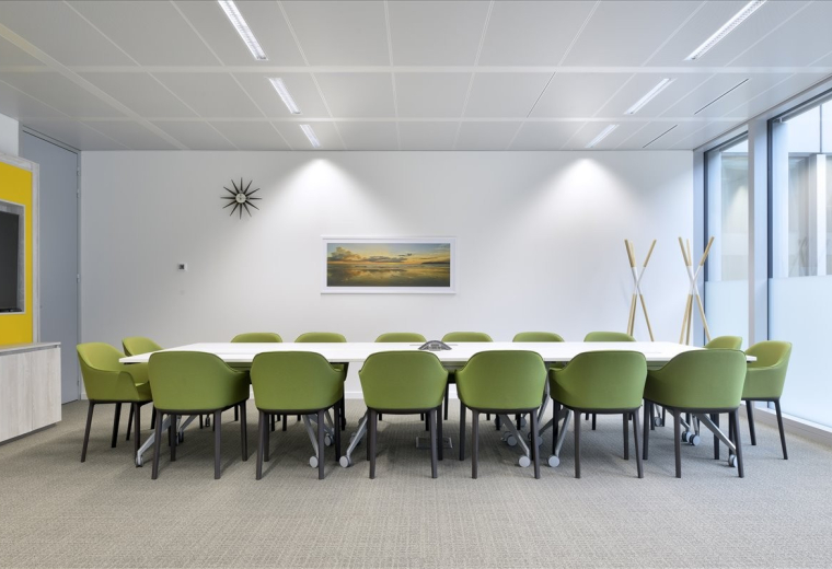Meeting room at Kavi Mall, Plot B-13B, Alnarges, Fifth Settlement, New Cairo with lime green chairs and wall art.