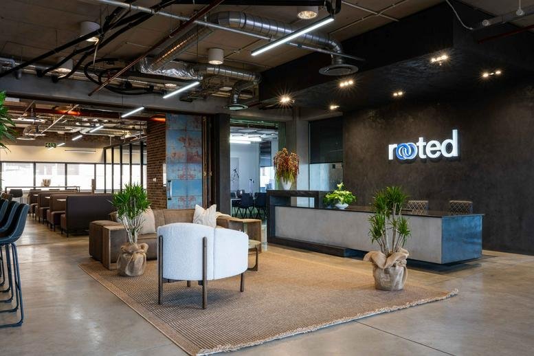 Spacious reception area with the Rooted logo at 30 Jellicoe Avenue.
