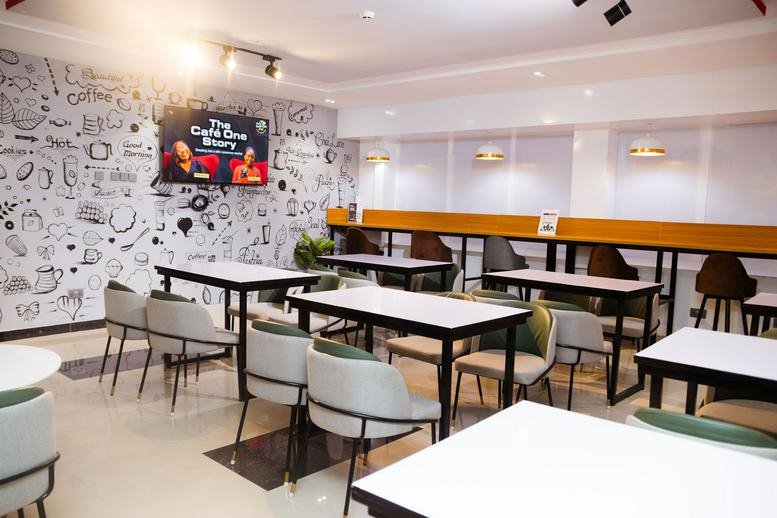 Spacious coworking area at 162 Oron Road, Central Business District, Uyo, Nigeria with doodle-art feature wall.