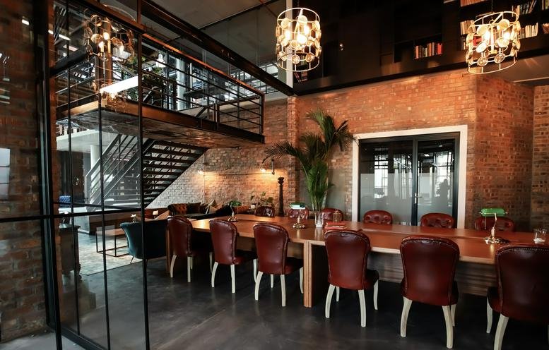 Spacious communal dining and meeting area at The Old Foundry, 1 Sand Hill Road.