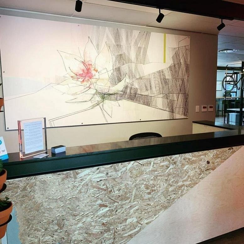 Reception area at 11 Hazelwood Road, 1st Floor featuring a large abstract floral mural and wood-textured desk.