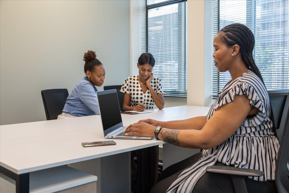 Exterior view of the glass-facade building at 115 Paul Kruger Street, Pretoria Central.