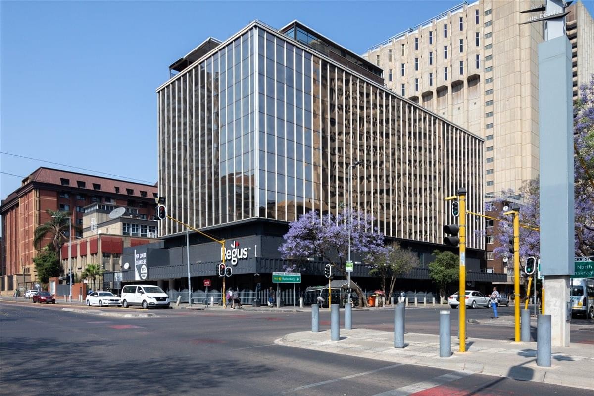 Exterior view of the multi-story glass and concrete building at 115 Paul Kruger Street, 2nd Floor.