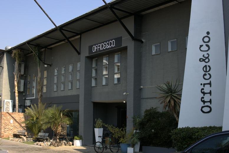Industrial-style building exterior at 134 River Road, Kyalami, Midrand with branded signage.