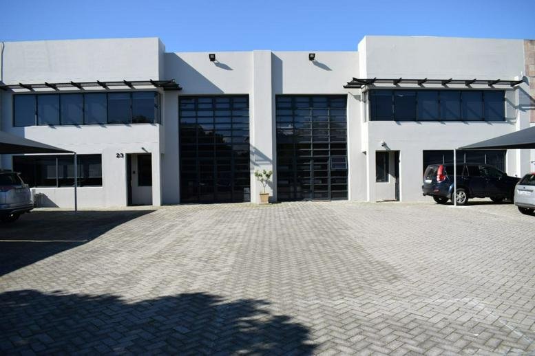 Exterior view of the white modern building facade at 23 Concorde Crescent.
