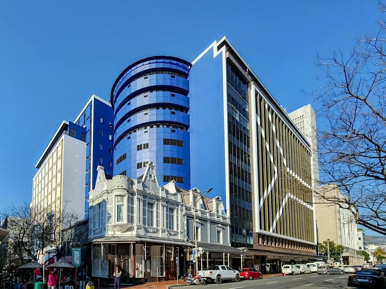Exterior view of the vibrant blue facade of 38 Wale Street in the city centre.