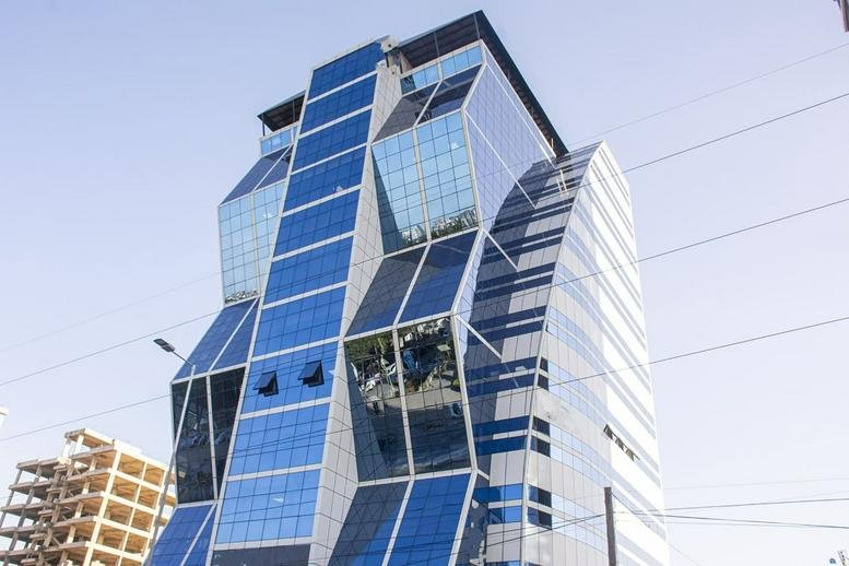 Exterior view of the striking geometric glass facade at 4 New Bagamoyo Road.