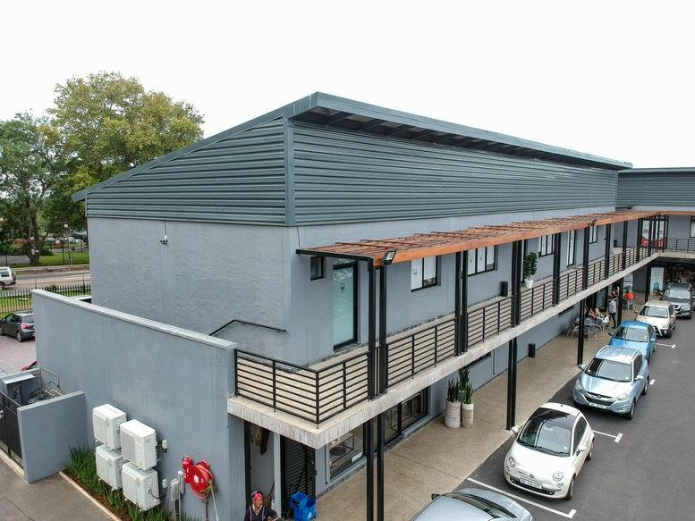 Exterior view of the grey multi-story building at 71 Old Main Road, Hillcrest.