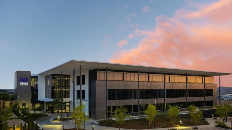 Exterior view of the modern glass and steel facade at Waterfall Corporate Campus, Building 5.