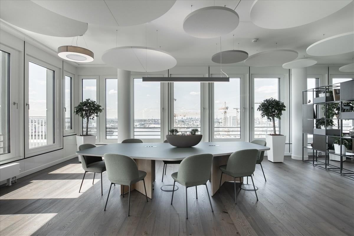 Spacious meeting room at 1 Avenue Ahmed Balafrej, Souissi, Rabat, Morocco with circular acoustic ceiling panels.