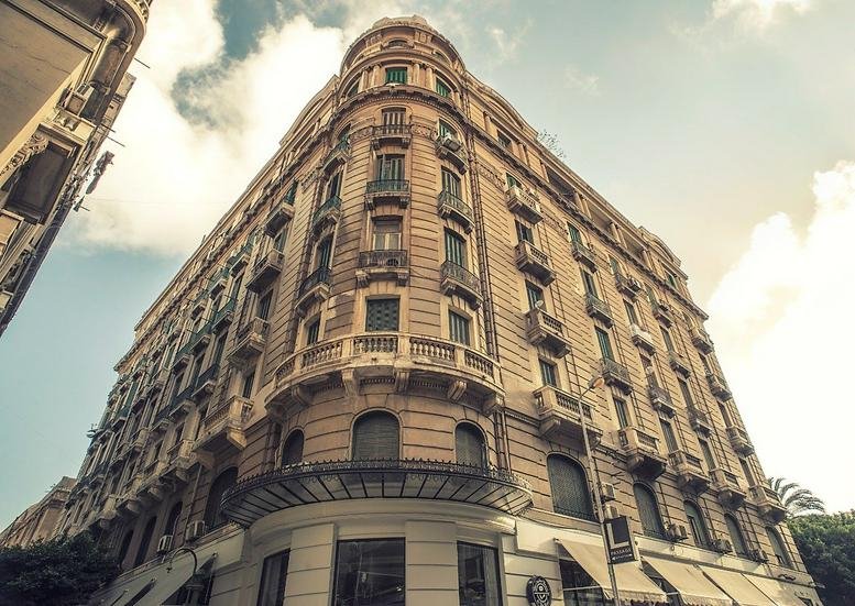 Exterior view of the ornate historical facade of the Avierino Building on Fouad Street.