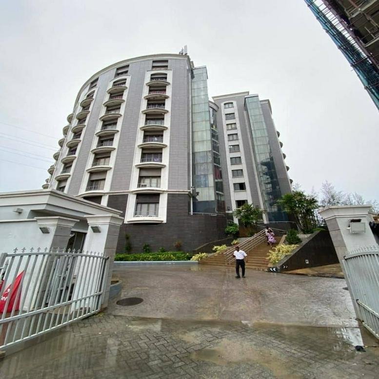 Exterior view of the curved facade and entrance of The Campus 300, Banana Island, Ikoyi, Lagos, Nigeria.