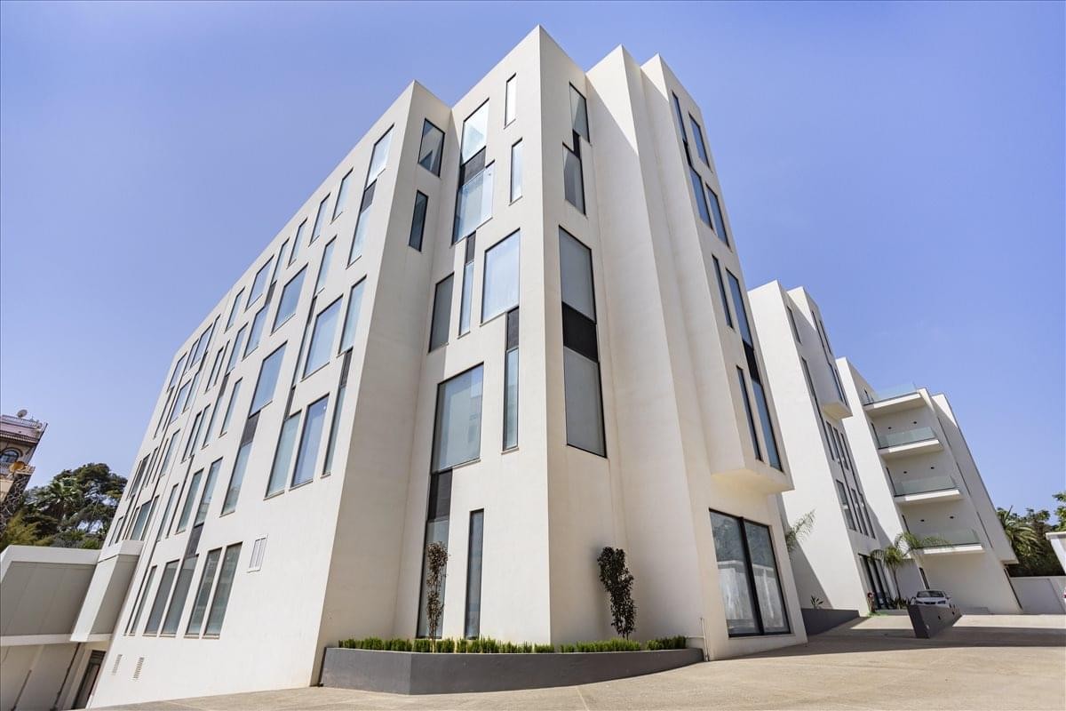 Exterior view of the white modern architecture at Business Park, Boulevard du 11 Décembre, Val Hydra.