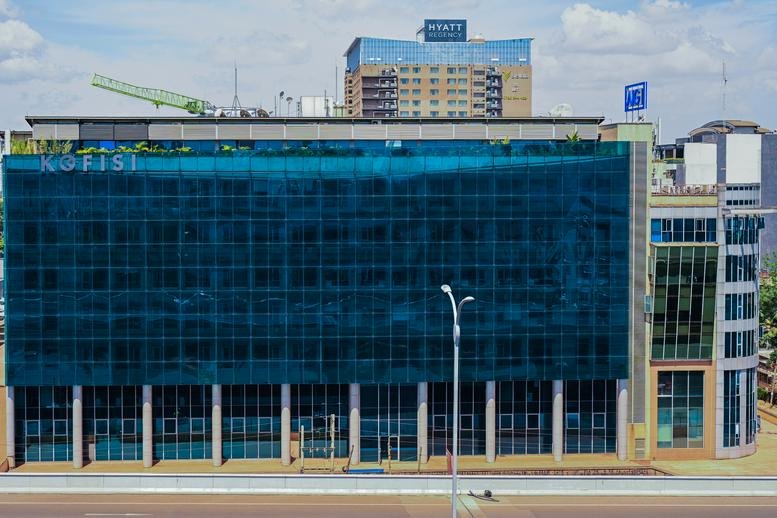 Exterior view of the blue glass-facade Eden Square building.