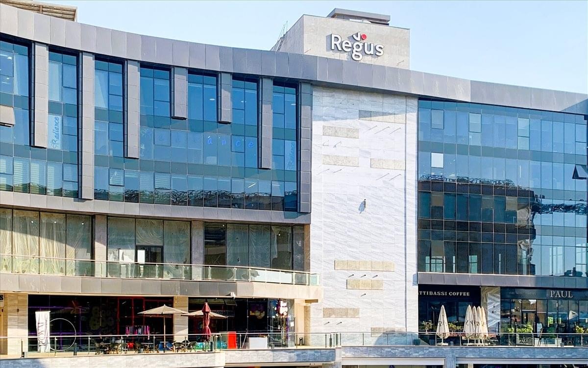 Exterior facade of the Arabella Plaza building featuring glass walls and modern architecture.