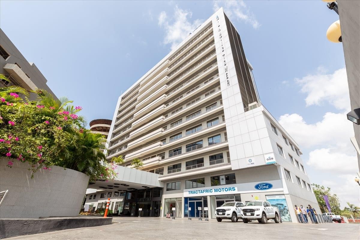 Exterior view of the multi-story white building at Liberation Road, Accra, Ghana.