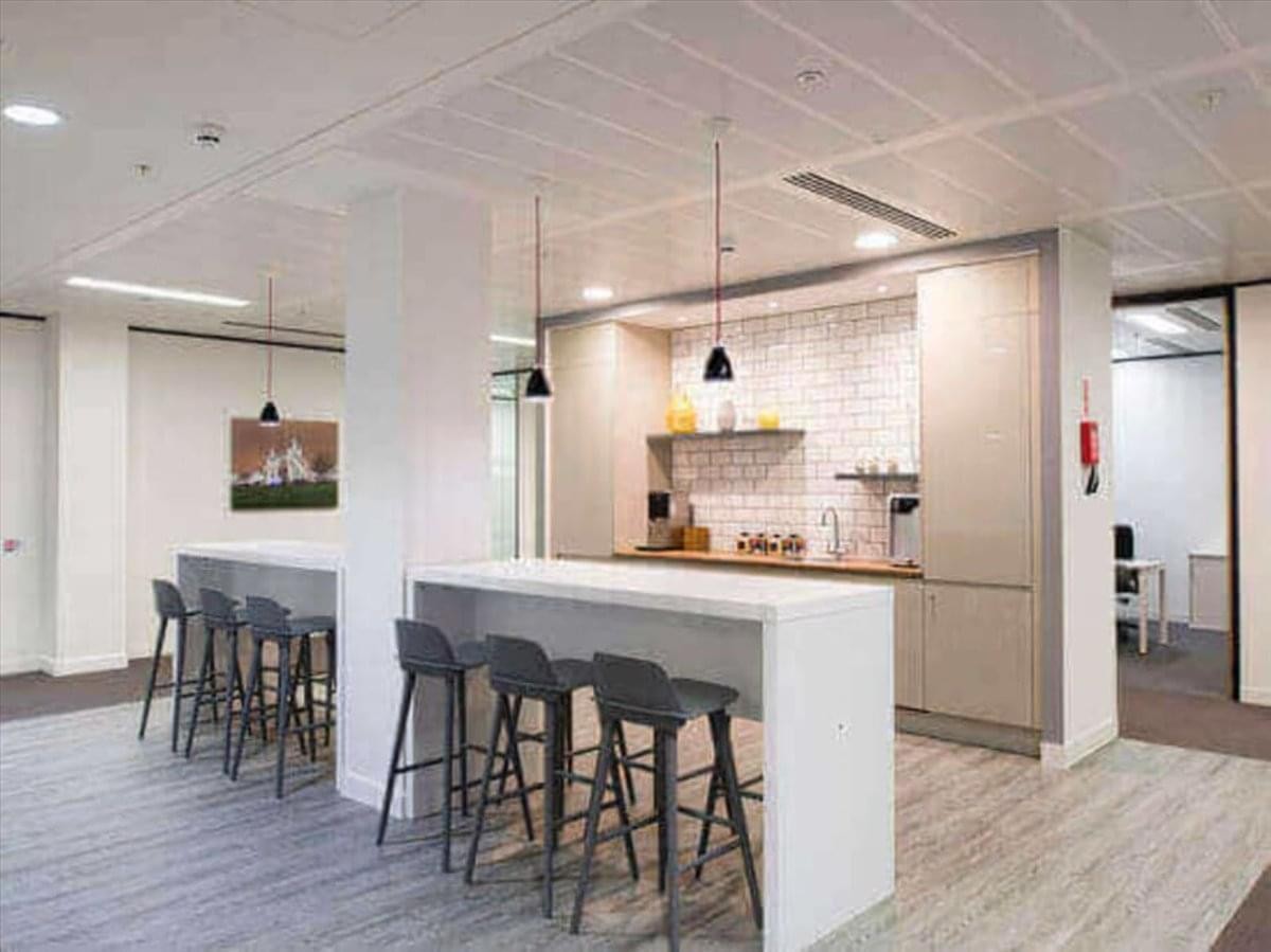 Spacious breakout area at Mombasa City Mall featuring a breakfast bar with stools and a modern kitchen.