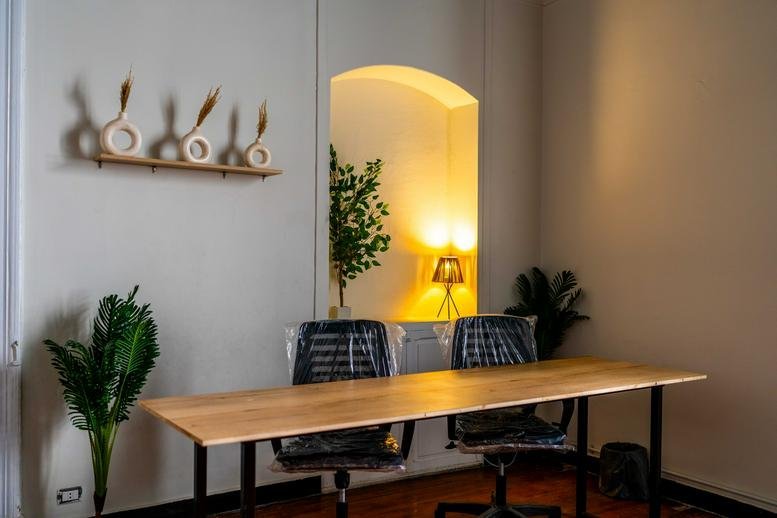 Spacious wooden desk in a bright room at The Circle, 15 Ali Zou Al Fekar, Kafr Abdo, Alexandria.