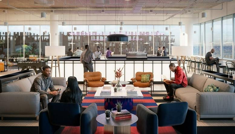 Spacious communal lounge at 173 Oxford Road with diverse seating, area rugs, and floor-to-ceiling windows.