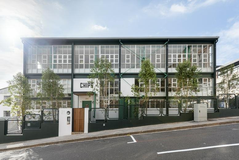 Exterior view of the glass and steel building at CHIPS, 21 Roodehek Street.