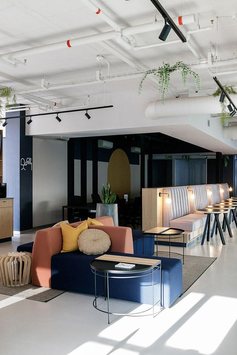 Spacious communal lounge at Cape Quarter, 27 Somerset Road with colorful modular sofas.