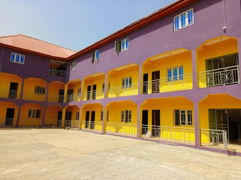 Colorful exterior of a yellow and purple building.