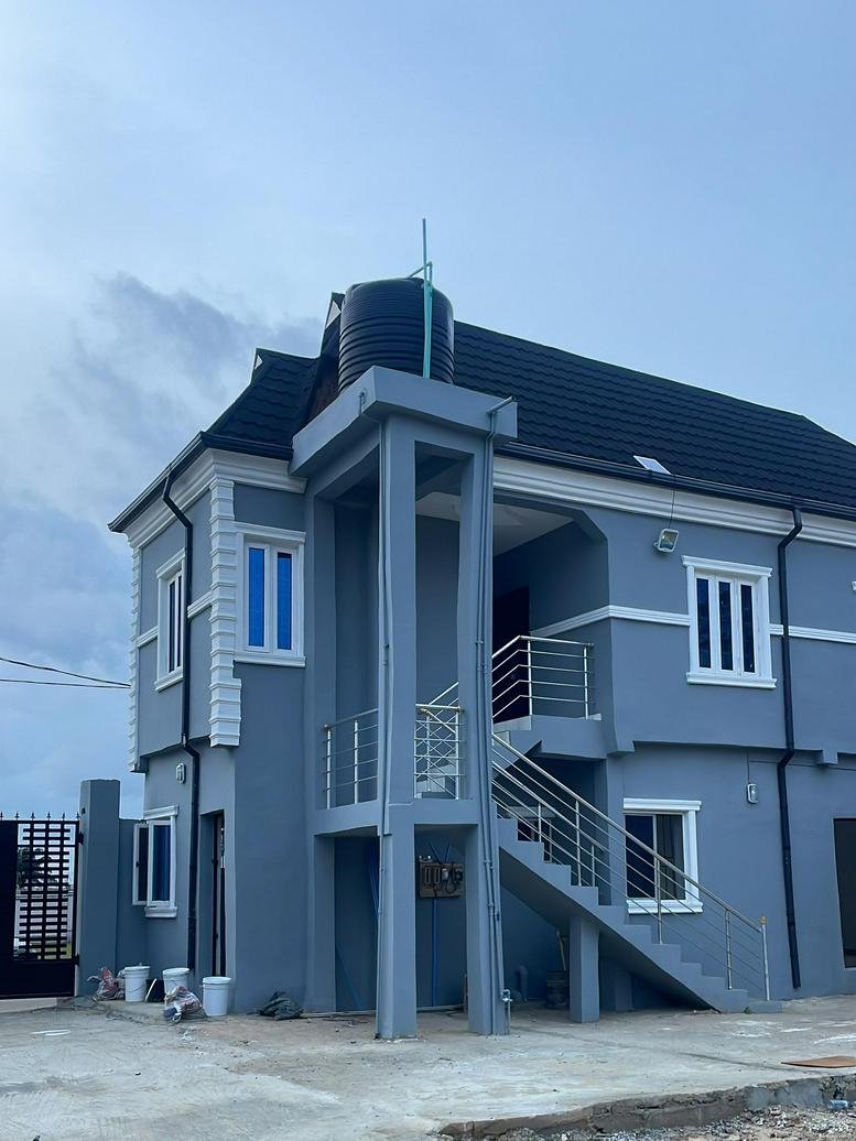 Exterior view of the grey two-story building at Haut Hub, Adebowale Road, Odo-Mola, Epe, Nigeria.