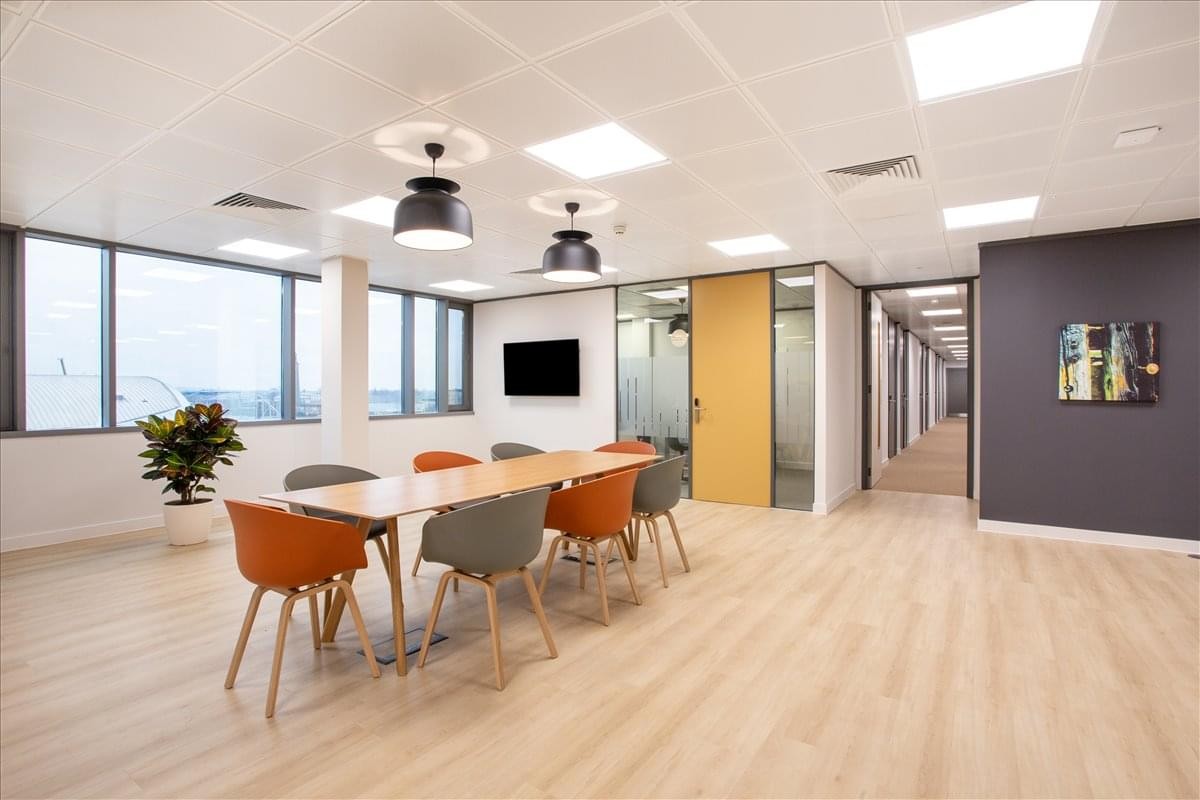 Spacious coworking area at Annlin Forum, 2nd Floor, 3 Dorothea Street with orange and grey seating.