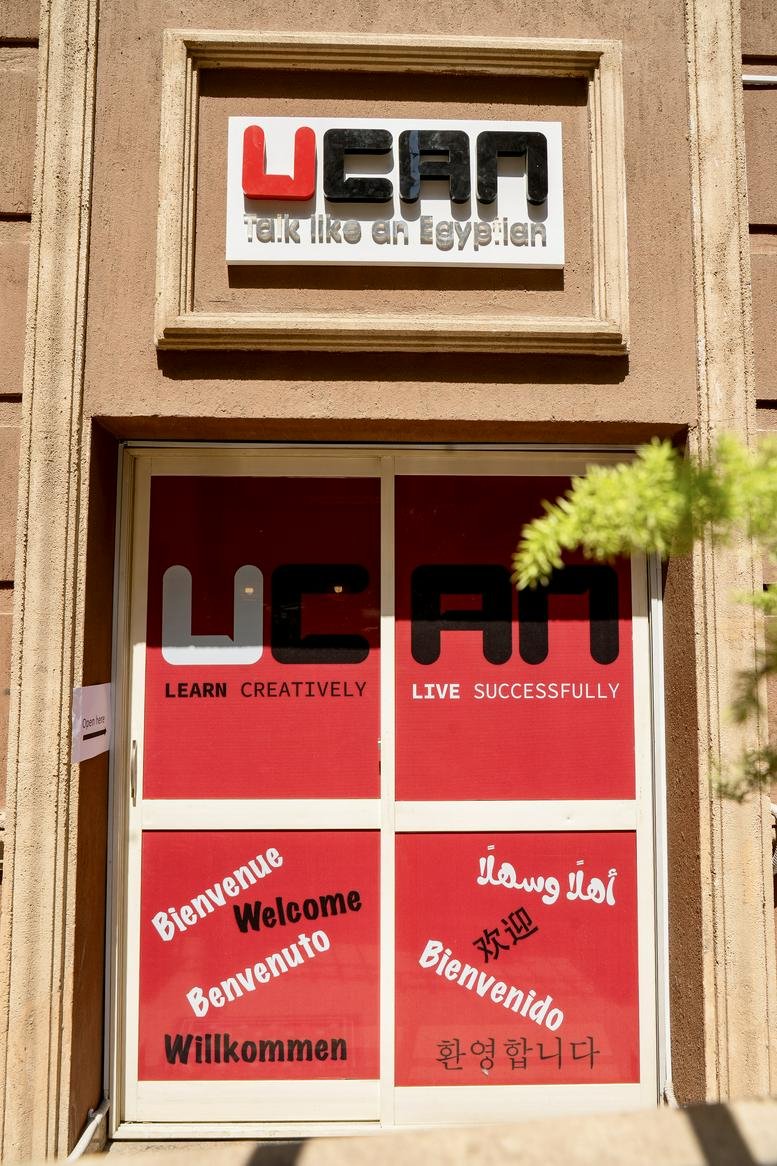 Entrance of UCAN Connect, Building 30, Street 200, Degla Maadi, Cairo featuring red and white welcome signage.
