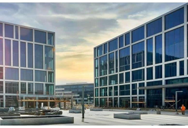 Exterior view of the modern glass-facade buildings at Cairo Festival City Mall, South 90th Street, New Cairo.