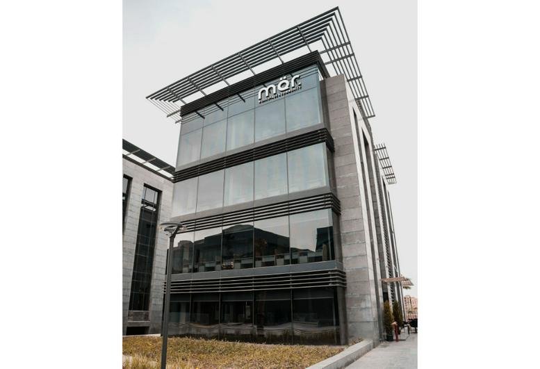 Exterior view of the modern glass-fronted building at Cairo Business Park, New Cairo.