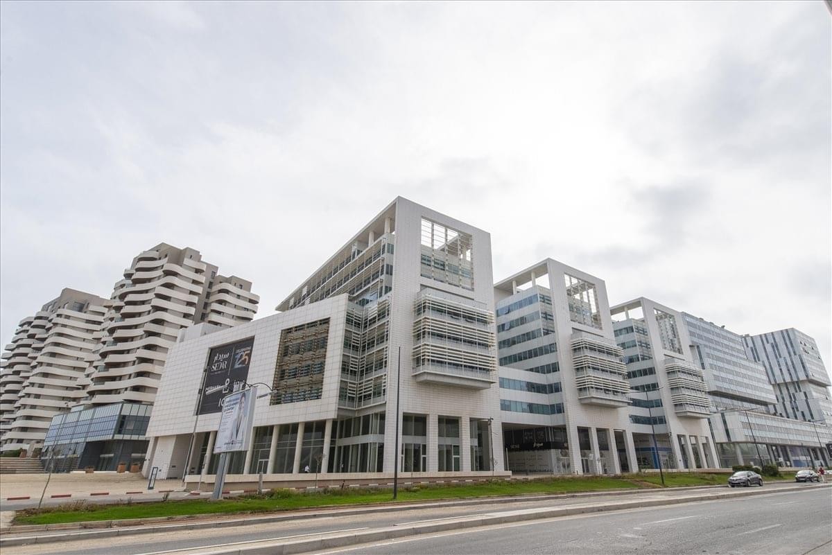 Exterior view of the contemporary white facade of Crystal Building 1.