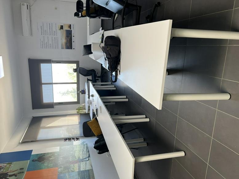 Open-plan office at Centre Millennium, 2nd Floor, Block B, Sidi Daoud, La Marsa with white desks and black chairs.