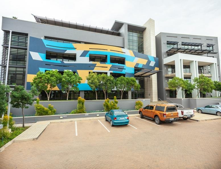Exterior view of the mural-covered Corobay Corner Building A in Waterkloof Glen.