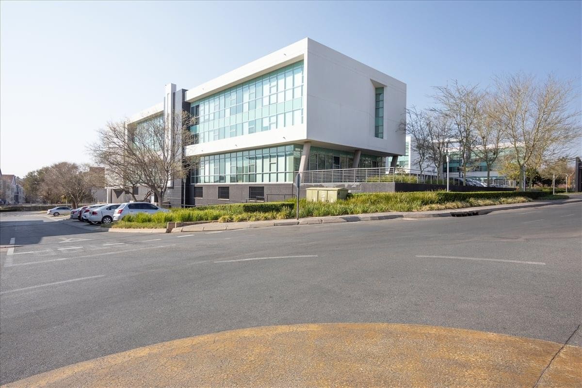 Exterior of the modern white and glass Design Quarter, Nicol Grove Office Park building.