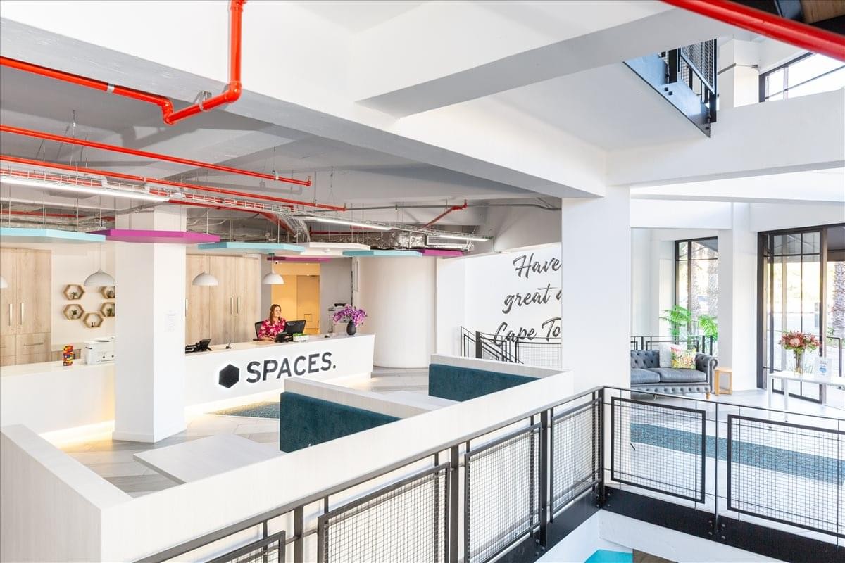 Contemporary reception area at Dock Road Building, V&A Waterfront, Cape Town, South Africa with industrial ceilings.