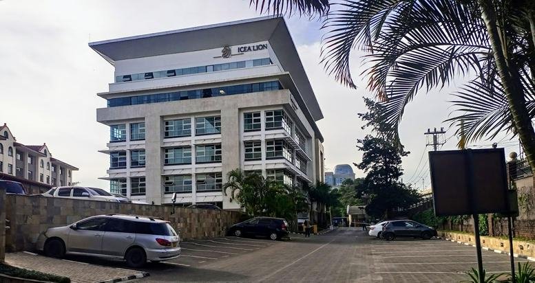 Exterior view of the contemporary white facade at ICEA Lion business Center, Waiyaki Way, Nairobi, Kenya.