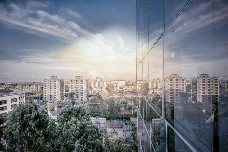 Exterior view of the glass-facade Pinetree Plaza at Kaburu Drive.