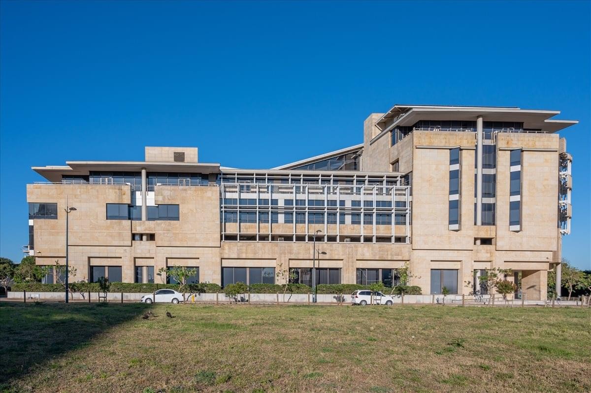Exterior view of the multi-story Liberty Life building with its stone facade and modern windows.