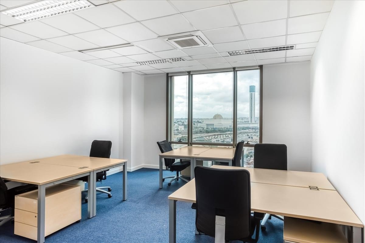 Spacious three-person office suite at 11th Floor, Pins Maritime with large windows and city views.