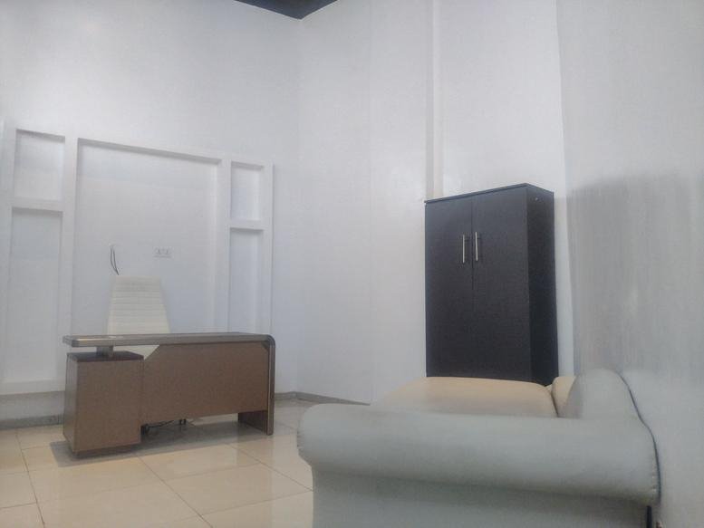 Spacious private office at Banex Mall, Plot 1-10 Akiogun Road, Oniru with a modern wood desk and storage cabinet.