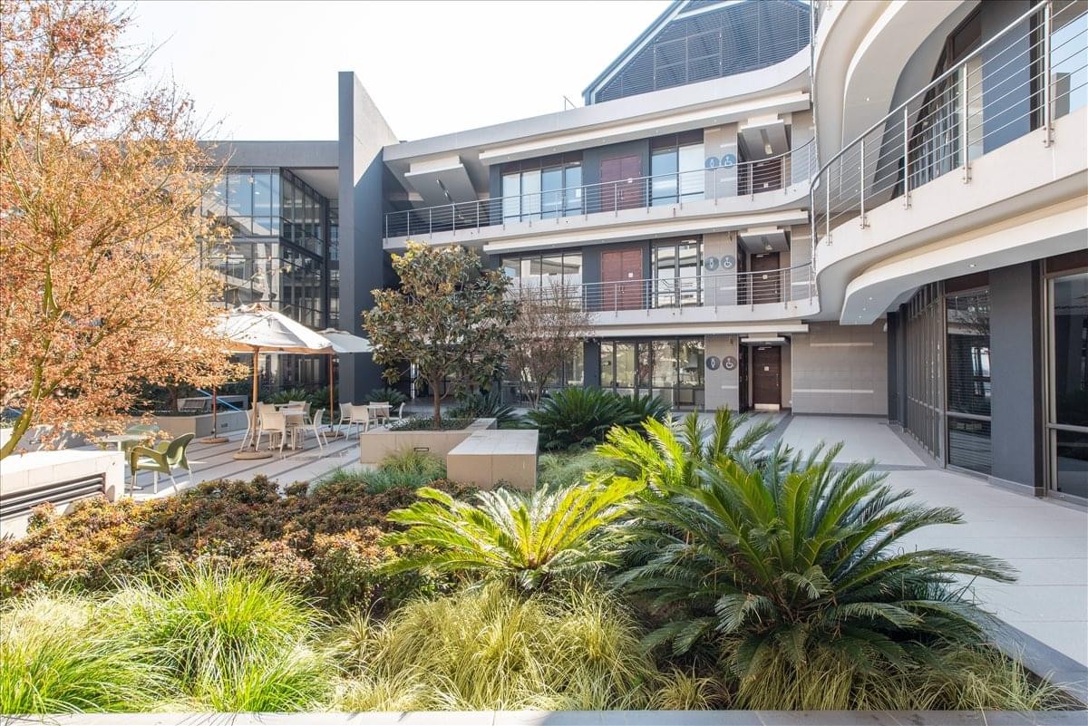 Exterior view of the modern courtyard and facade at Southdowns Ridge Office Park.